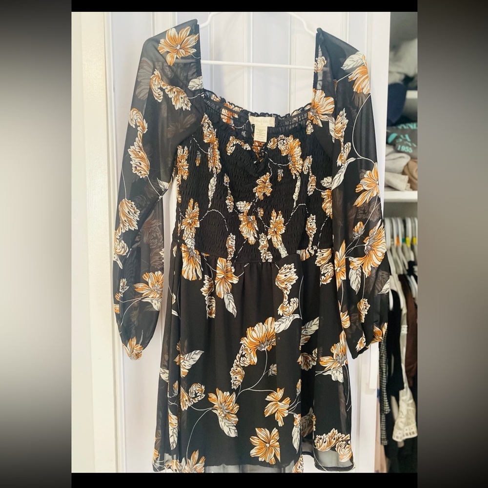 Black and orange printed dress. Long sleeve sheer